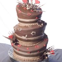 Chocolate Topsy Turvy chocolate chocolate chip cake layered with chocolate cream cheese frosting covered in chocolate marshmallow fondant