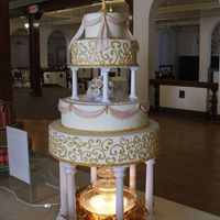 Gold Scrolls This is a dummy cake that I made for a bridal show. The vase and all of the flowers are gumpaste.