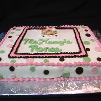 Baby Shower Cake Iced in buttercream, fondant baby, blanket and polka dots. 1st time using baby mold.