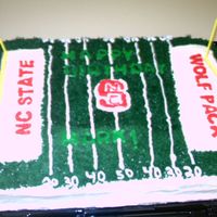 Football Field sheetcake iced in bc with fondant letters to look like happy birthday was cut in the grass. the emblems and wording were fbct's my...