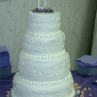Imag0296.jpg 4tiers vanilla cake with bc icing. this was my first paid wedding cake for a non-family member. all comments welcome good or bad!