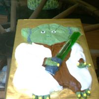 Yoda this was for my nephew's birthday it is a sheet cake carved to shape iced in bc popicle for light saber. first attempt at using mmf....