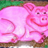 Lazy Pig 1/4 sheet cake carved to shape and covered in buttercream and airbrushed.