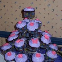 Cupcakes To Accompany Tinkerbell Cake I made these to go with the Tinkerbell Cake. The flowers and butterflies are fondant. They were a hit!