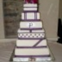 Jenna's Wedding Cake 6-8-10-12-14 & 16 inch squares covered with fondant and each layer designed differently.