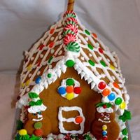 Gingerbread House I made royal icing to glue the base together then let my 2 kids (ages 6 & 8) decorate away. This is what they came up with.