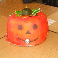 Pumpkin Cake My 1st try at a Jack-o-Lantern cake. Pumpkin spice cake with Dream Whip icing and fondant. Good rave reviews at the school party.