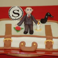 Suitcase Cake For Hotel Manager This was for the manager of the Sheraton Hotel who is relocating to another country. The candle, rose, and music note all have significance...