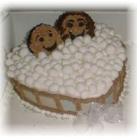 Hot Tub Couple The couple are cupcakes, and the bubbles are fondant. This sat on a sheet cake.
