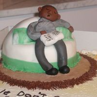 Sleeping Man My first attempt at modeling. The chair is cake, and is sitting on top of a full sheet cake.