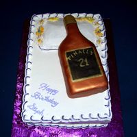 21St Birthday Cake With A Bottle And A Pillow I did this for one of the secrateries at work who was turning 21. Double layer lemon cake. Bottle was shaped out of rice crispies, then...