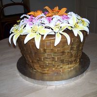 Basket Of Flowers I did this cake for another secretary at work. The cake was huge !! They were eating it for a week, lol. Started out with 6 14 inch layers...