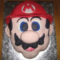 Super Mario Thanks so much to msauer for all of her help! My husband was thrilled with this cake. It is chocolate fudge cake with double chocolate...