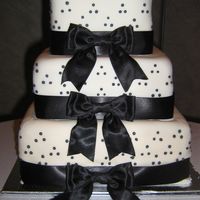 Dots And Ribbon Thanks to the inspiration! This cake was a gift for a friend and they loved it! The topper was a ceramic bride and groom