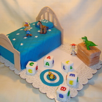 Toy Story This was for a repeat client. The toys are real, as I like to have a "keeper" for small kids for their cakes. Hard to play with...
