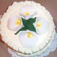 Calla's On Top An engagement cake I did with all cream colored buttercream and fondant shaped calla lillies which were all shaped with household items...