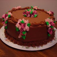 Chocolate Buttercream French vanilla cake with chocolate buttercream. Buttercream wisteria finish it off.