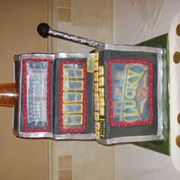 Slot Machine Made this for my uncle who celebrated his 65th birthday. His face was printed on edible paper and placed on the "payline" Plastic...