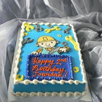 Bob The Builder! Vanilla cake with chocolate Bob the Builder. Used star tip for wrenches and bolts.