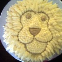 Lion_2.jpg This is a 6 inch round cake decorated in B/C icing made to look like a lion. The Lions mane is made by using a star tip (#32).