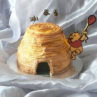 I Dream Of Honey! Vanilla cake baked in Pyrex bowl and 8" x 3" cake pan. Pooh and bees are chocolate. Cake was airbrushed brown and yellow. Got...