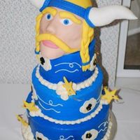 Viking Graduation A 6", 8" and 10" chiffon cake if filled with strawberries and whipped cream. It's frosted with traditional buttercream...
