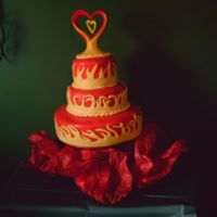 Flame Wedding Cake This was my first fondant cake. The couple wanted it to match their custom painted motorcycle. The topper is the white Wilton porcelain...