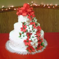Poinsetta/christmas Wedding Cake This is a white/chocolate/white cake with BC frosting. The poinsettas and holly are gumpaste. I bought them at Sugarcraft after my woeful...
