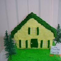 Congratulations On Your New Home Wilton 3-D house pan on top of 9" square pan. everything decorated in buttercream