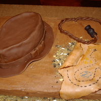 Indiana Jones This cake was for a six year olds birthday. He wanted Indiana Jones theme. The hate is fondant covered over a two layered oval chocolate...