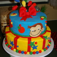 Curious George Curious George cake for a little girl turning three. She loved the idea of Curious George on her cake and wanted the fun red, blue and...