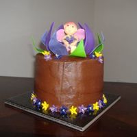 Lilly Cake This is a chocolate cake with chocolate buttercream. All the decorations are made of fondant.