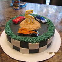 Nascar Fun little Nascar cake for my son's 5th birthday party! All the kids loved it and each one got to take one car home.