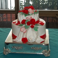 70Th Wedding Anniversary Cake This cake was for a 70th (yes, 70th!) wedding anniversary. The red fondant is Satin Ice and the white is Dawn. All very tasty.