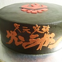 Gurren Lagann I made this for a friend. She is really into Anime. The decorations are fondant/gumpaste mix. It took forever to cut out the Japanese...