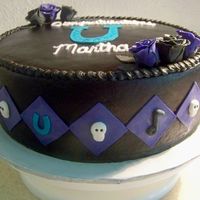 Martha's Graduation Cake chocolate almond buttercream. fondant/gumpaste decorations. the graduation girl's school colors were black, teal, and gold but she...