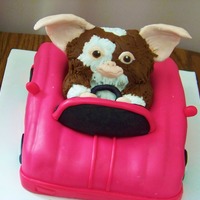 Gizmo the car is cake covered in fondant. Gizmo is made out of RKT and fondant.