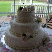 Fondant Wedding Cake With Pink Roses This is this cake that I made I made for my wedding. Its fondant with gumpaste roses. I got my inspiration from bjfranco. Mine does'nt...