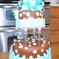 Brown And Blue Fondant with MMF ribbon, bow, and flowers