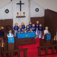 Gingerbread Praise This is for a gingerbread competition. It is a replica of my church's sanctuary, including the pastors. The people are made of fondant...