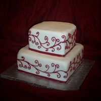 Red Scroll This is a small wedding cake - 8" and 6" square pan. It was inspired by a picture from the bride (which I do not know where it...