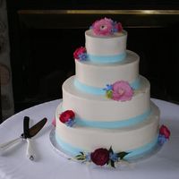 T-Sue's Wedding A cake for a friend/co-worker's wedding as my gift to them. It's the biggest cake I've made yet and it had quite a car ride...