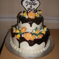 Julie's Shower Cake White Almond Sour Cream with raspberry buttercream and ganache. The roses are her fave flower (gumpaste) and the heart is chocolate. This...