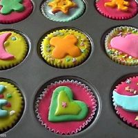 Cupcakes These are chocolate cupcakes. I used simple sugar icing (orange juice and icing sugar) and then topped with colored fondant cut with cookie...