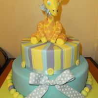 Baby Girrafe I made this cake as a gift for a beautiful baby boy who was recently born. The giraffe was made of fondant, and the cake was also covered...
