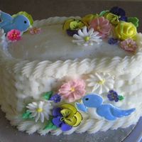 Wilton Basket Weave Basket weave is B.C., flowers are R.I., & bird is color flow.