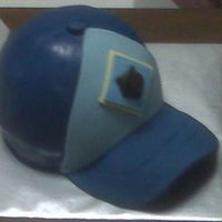 Cubs Scout Hat I used the sports ball pan for the main part of the hat and then cut the brim from fondant. The logo on the front was created by pressing...