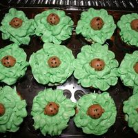 Cabbage Patch Cupcakes cupcakes with buttercream frosting. Baby heads are made from chocolate marshmallow fondant and details are drawn with edible markers. These...