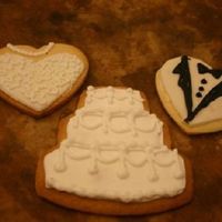 Wedding Cookies This idea came stright from this website. The only difference was that I rolled out MMF and cut the same design with the same cookie cutter...