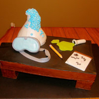 They Have Chemistry ;) Beaker is mostly cake with a little molded rice crispies on top covered in fondant, goggles are rice crispies...all else is fondant. Sits...